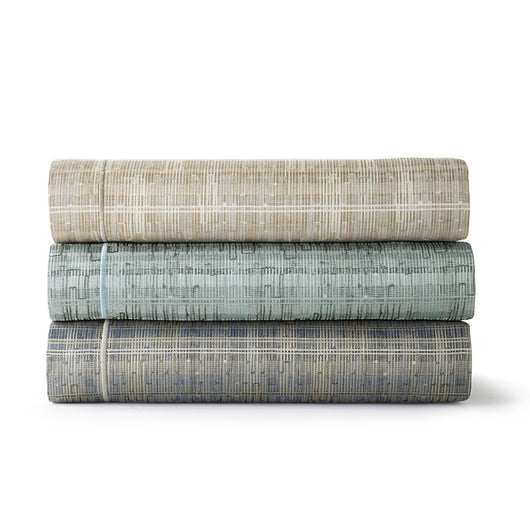 Italian jacquard fabric stack in linen, mist, and blue