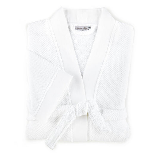 folded white cotton bath robe
