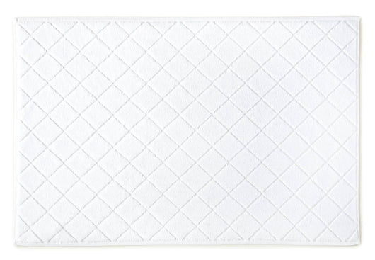 white cotton bath mat with sculpted diamond design