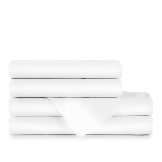 stack of folded white Nile egyptian cotton sheets